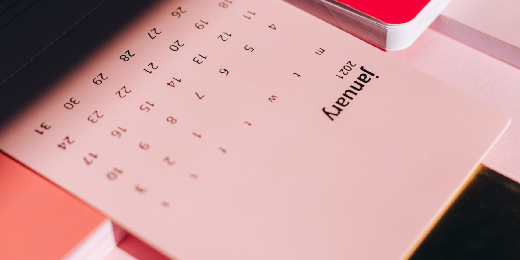 picture of calendar with January 2021 with red accents