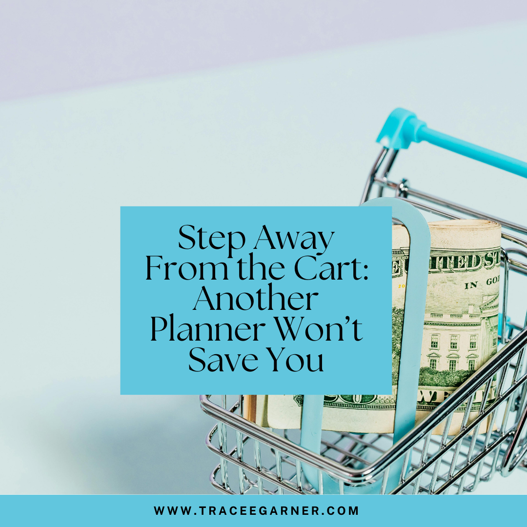 Pic of shopping card with wad of money sitting inside it.